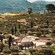 The terraced hills of Provence featuring vineyards, cypress trees and historic buildings